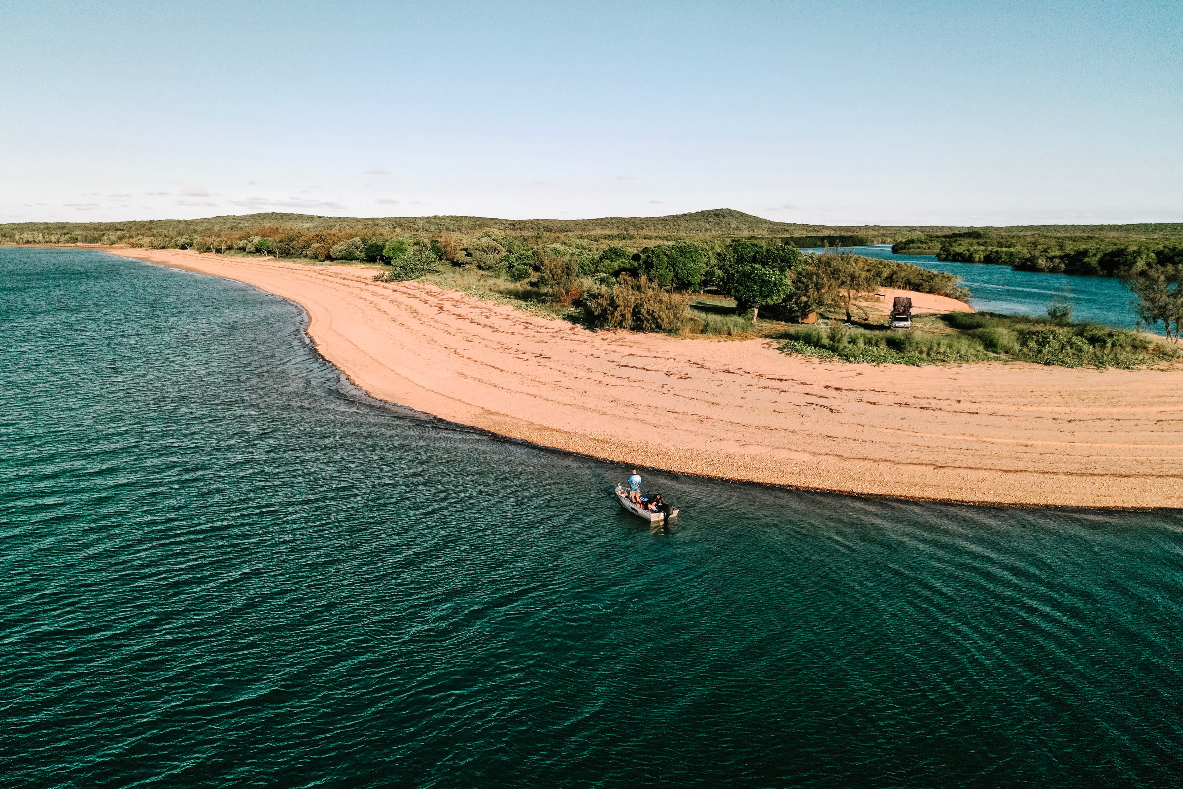 Aerial view of a Mackay coast estuary and fishing boat
